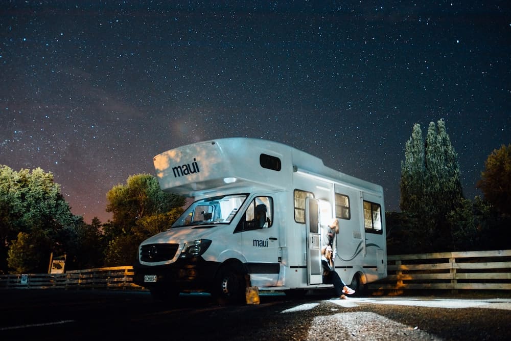 An RV parked at night.